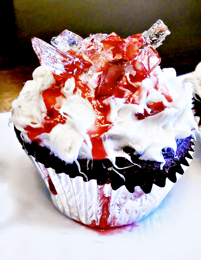 Bloody Broken Glass Cupcakes - Frosted cupcakes decorated with edible homemade sugar-based "broken glass" and edible "blood." Easy to make and perfect for a Halloween party!  