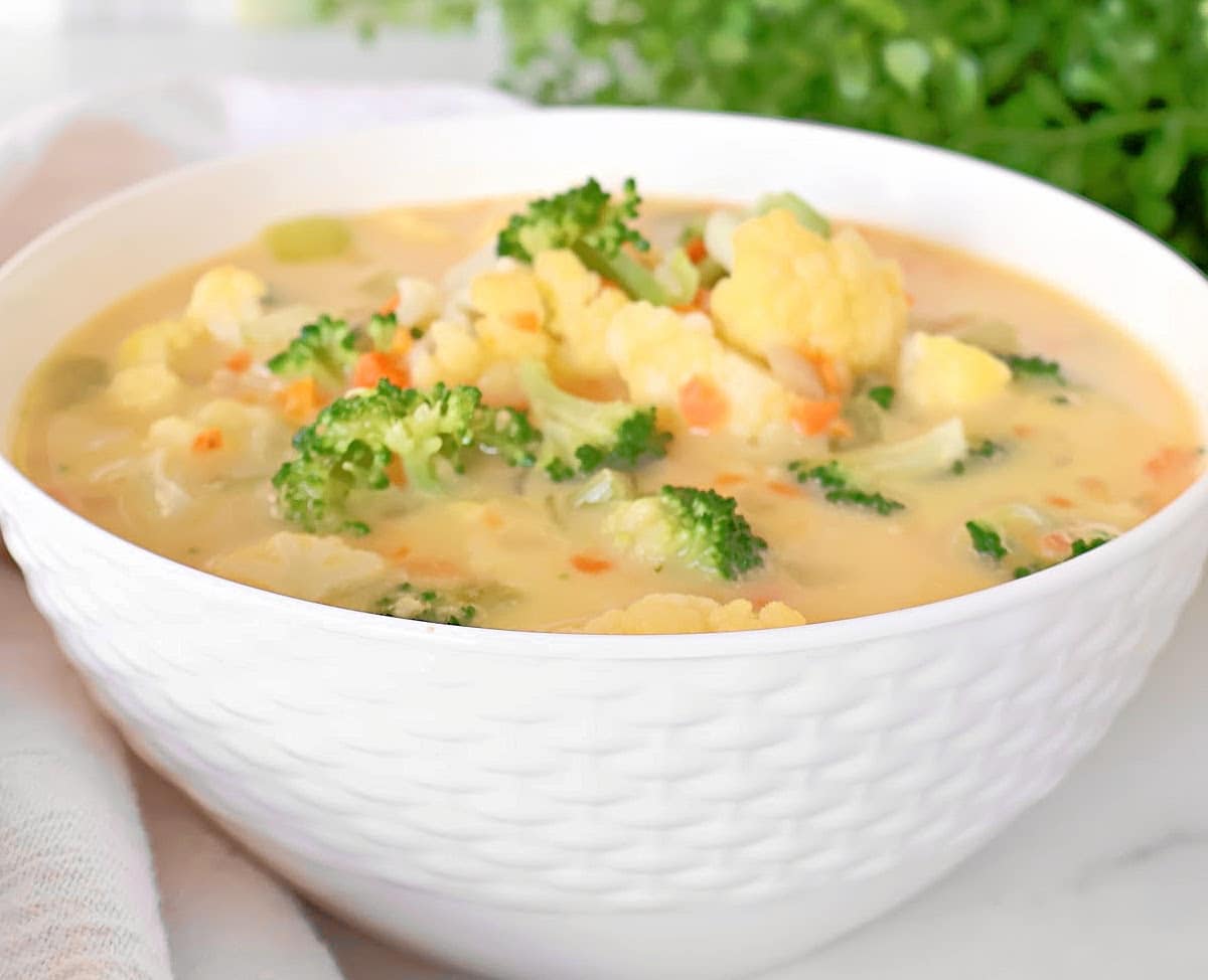 Cheesy Vegetable Chowder ~ A quick and comforting vegetable chowder packed with cheddar cheese and a medley of fresh vegetables. Vegan or Vegetarian.