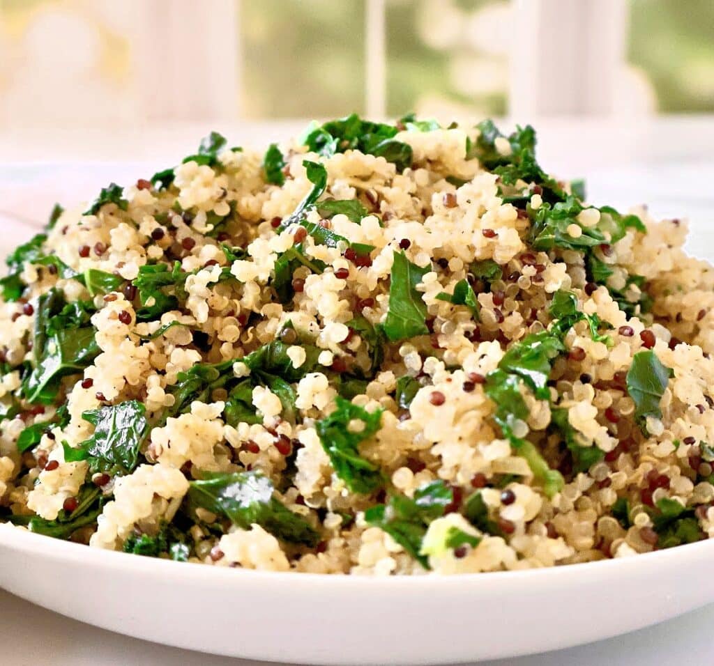 Quinoa and Kale ~ Warm kale salad featuring fluffy quinoa seasoned with zesty Creole spices.
