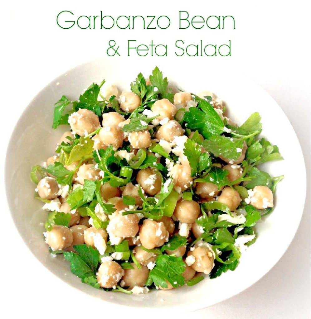 A white bowl filled with Garbanzo Bean and Feta Salad, featuring chickpeas, crumbled feta cheese, and fresh green herbs. The text above reads Garbanzo Bean & Feta Salad.