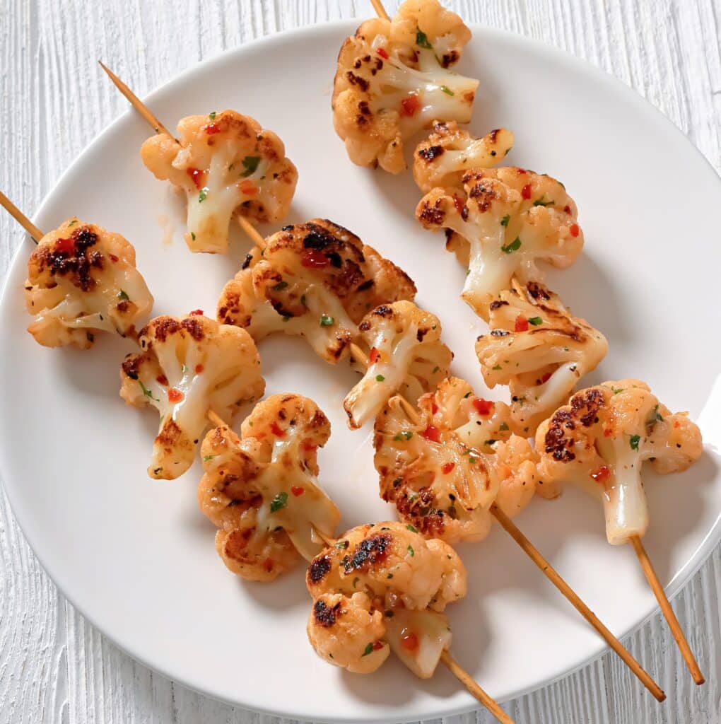 Grilled Cauliflower ~ Bite-sized cauliflower marinated in spices and grilled to perfection. Serve as a low carb main or side dish.