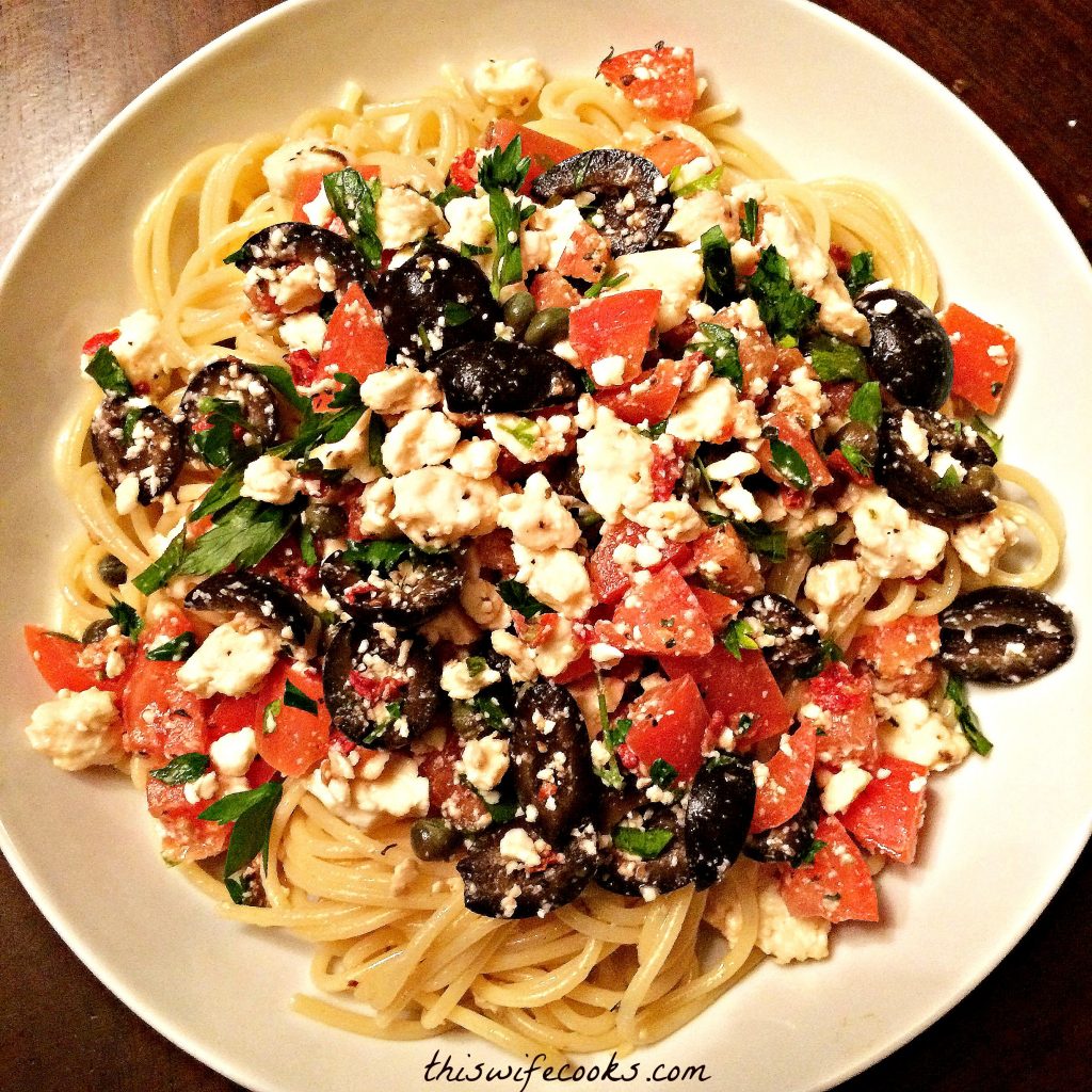 Vegan Mediterranean Pasta ~ A quick and easy Mediterranean-inspired dish with black olives, tomatoes, capers, and vegan feta cheese. Ready to serve in under 30 minutes!