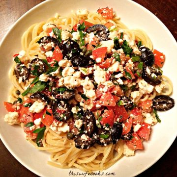 Vegan Mediterranean Pasta ~ A quick and easy Mediterranean-inspired dish with black olives, tomatoes, capers, and vegan feta cheese. Ready to serve in under 30 minutes!