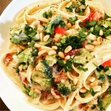 Vegan Fettuccine Alfredo with Broccoli, Red Peppers, and Pine Nuts