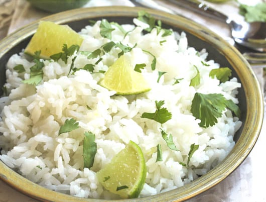 Cilantro Lime Rice - Simple and subtle, this easy rice is the perfect complement to bigger, bolder flavors found in hearty and spicy enchiladas or fajitas.