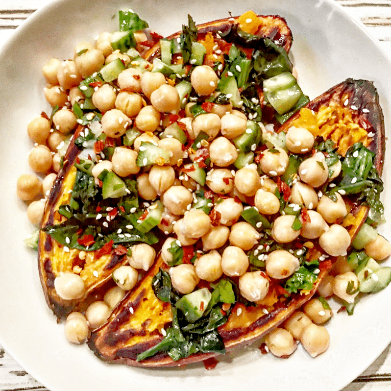 Chickpea and Bok Choy Sweet Potatoes ~ Warm, roasted sweet potatoes stuffed with steamed bok choy, crunchy cucumber, fresh parsley, and chickpeas, then drizzled with a creamy miso-tahini sauce and topped with Aleppo pepper flakes for the perfect blend of spicy and sweet.