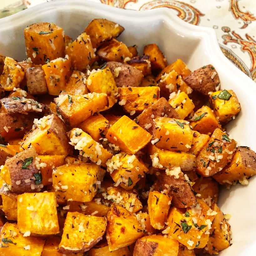 Holiday Roasted Sweet Potatoes | The irresistible flavor combination of sweet potatoes, garlic, herbs, parmesan make these potatoes perfect for the holiday table! via @thiswifecooks