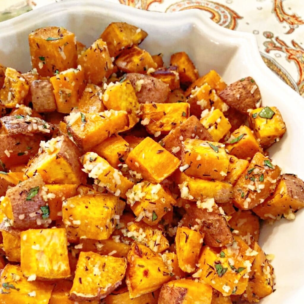 Herb Roasted Sweet Potatoes ~ Roasted sweet potatoes with garlic, thyme, and parmesan. Easy and savory side dish for the holiday table!