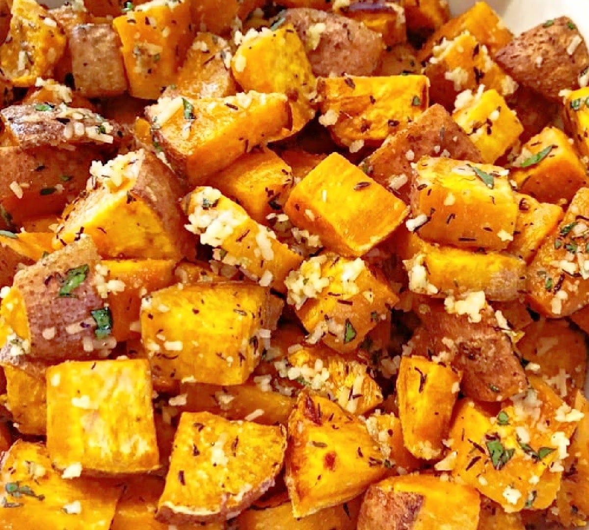 Herb Roasted Sweet Potatoes ~ Roasted sweet potatoes with garlic, thyme, and parmesan. Easy and savory side dish for the holiday table!