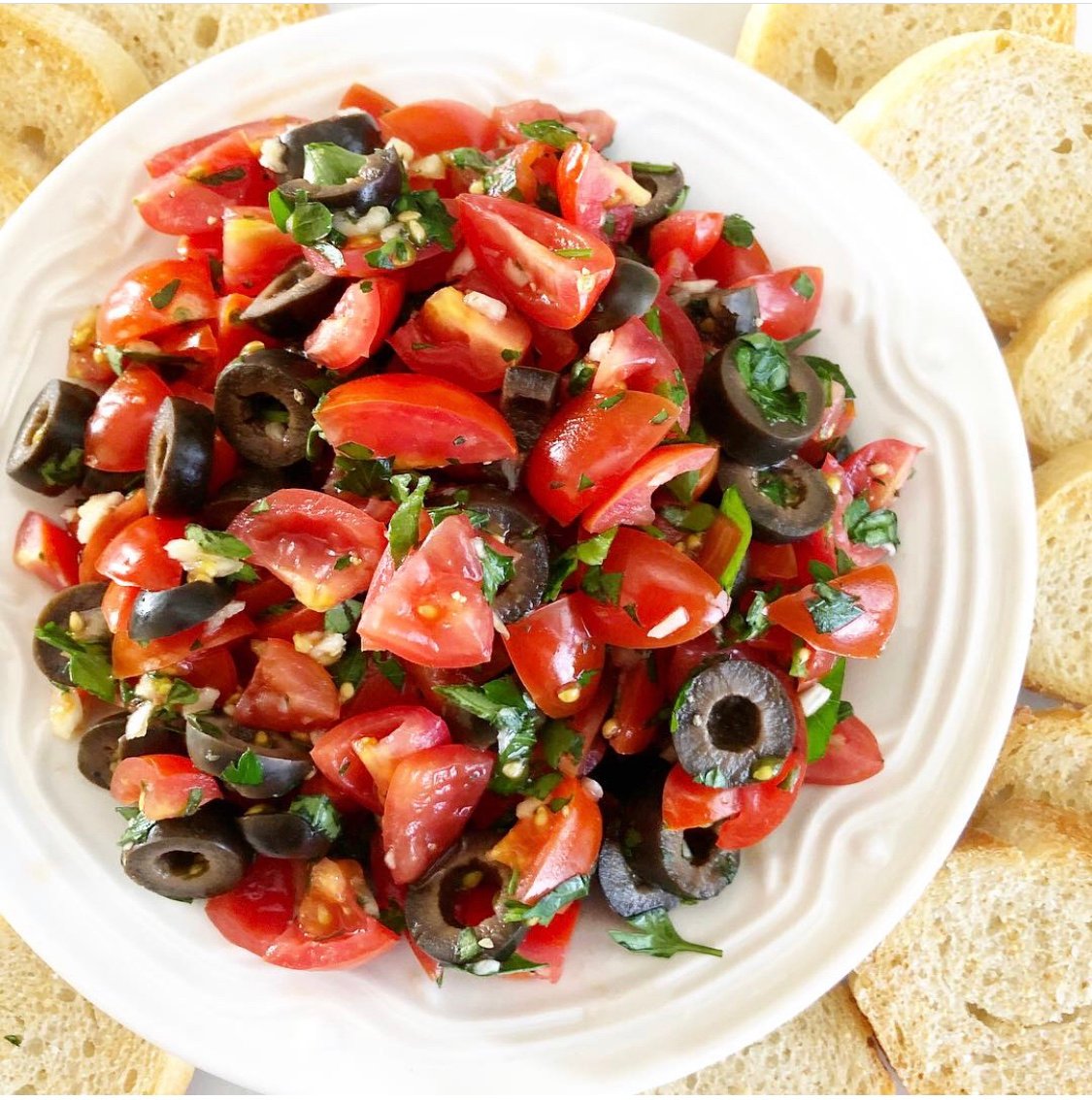 Tomato and Black Olive Bruschetta - Simple and elegant. Perfect for a casual picnic lunch for two or when entertaining guests at home. via @thiswifecooks