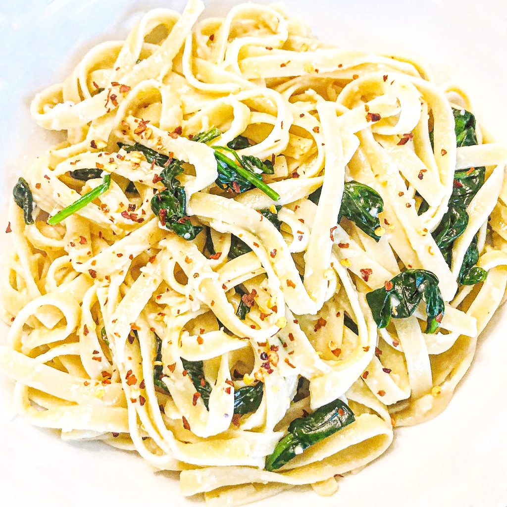Vegan Spinach Parmesan Fettuccine | Busy days call for quick and easy dinners! This is a favorite go-to meals when we're short on time or just want the simplicity of an easy, no-fuss pasta dinner.