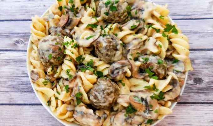 Vegan Lentil Meatball Stroganoff |A rich and creamy stroganoff made with homemade, pan-seared lentil meatballs tossed in a vegan sour-cream-and-mushroom sauce and served over wide fusilli pasta.