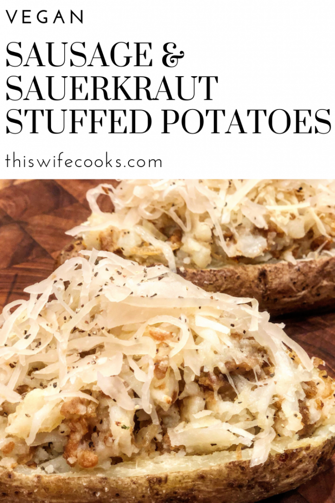 Two halved baked potatoes are stuffed with vegan sausage and sauerkraut, then topped with black pepper, displayed on a wooden surface. Text above reads: Vegan Sausage & Sauerkraut Stuffed Potatoes.