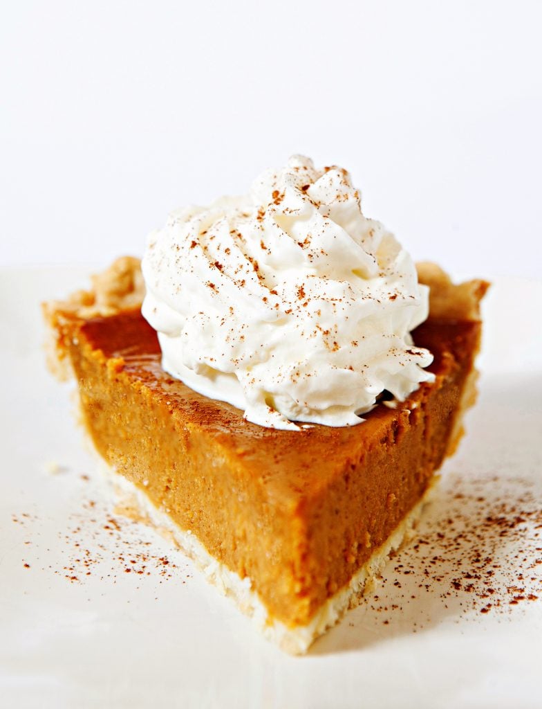 Vegan Thanksgiving Pumpkin Pie - The iconic, quintessential pie of Thanksgiving! Rich, creamy, and loaded with spices of the season. Easy & comforting - a family favorite year after year!
