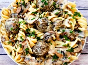 Vegan Lentil Meatball Stroganoff |A rich and creamy stroganoff made with homemade, pan-seared lentil meatballs tossed in a vegan sour-cream-and-mushroom sauce and served over wide fusilli pasta.