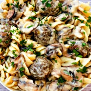 Vegan Lentil Meatball Stroganoff | A rich and creamy stroganoff made with homemade, pan-seared lentil meatballs tossed in a vegan sour-cream-and-mushroom sauce and served over wide fusilli pasta.