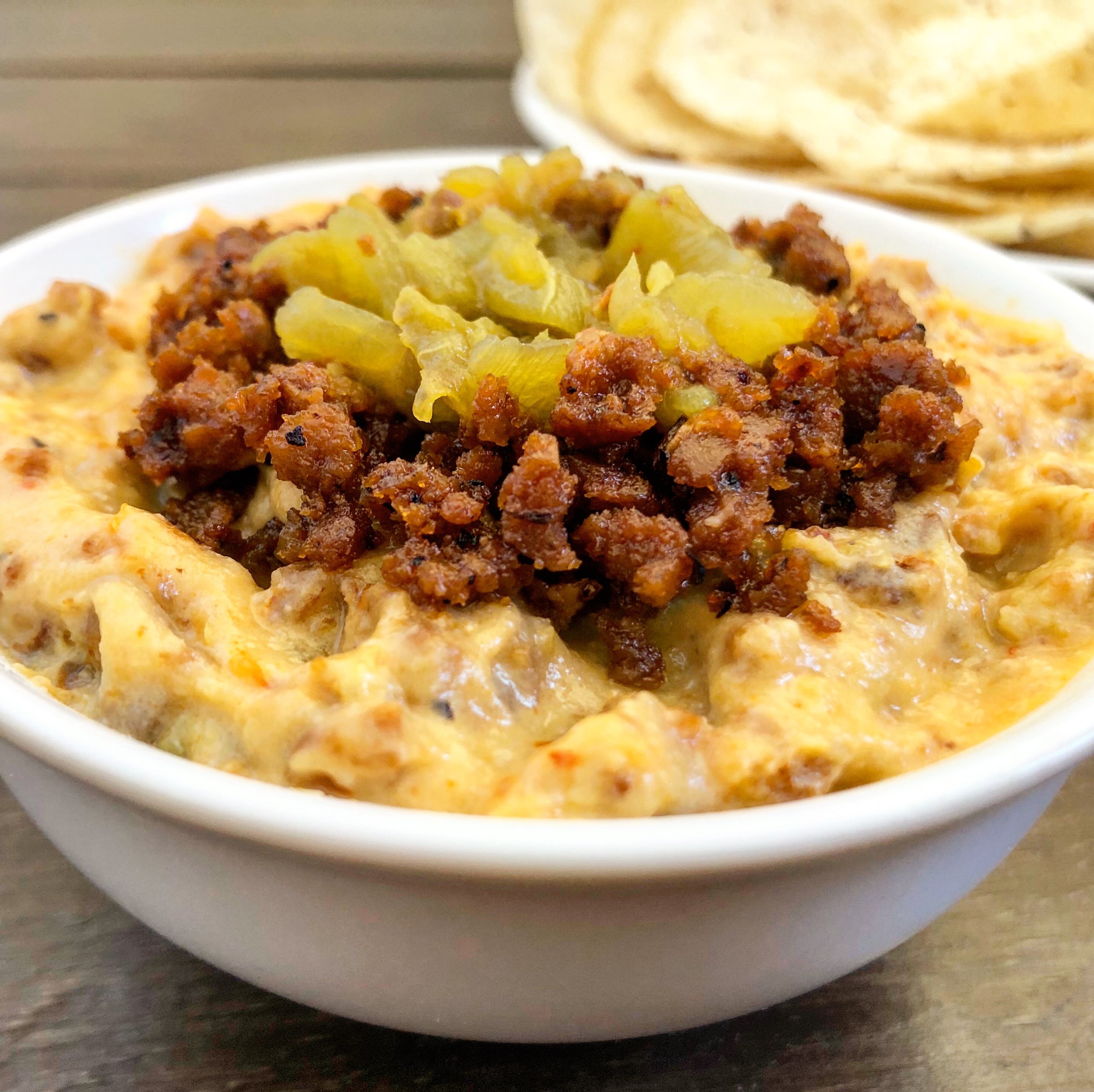 Vegan Green Chile & Chorizo Queso - Loaded with savory flavors of green chiles and chorizo, this hearty and easy to make dip is perfect for Game Day snacking! #vegancincodemayo #veganqueso #veganmexicanrecipes #vegandip #thiswifecooksrecipes via @thiswifecooks