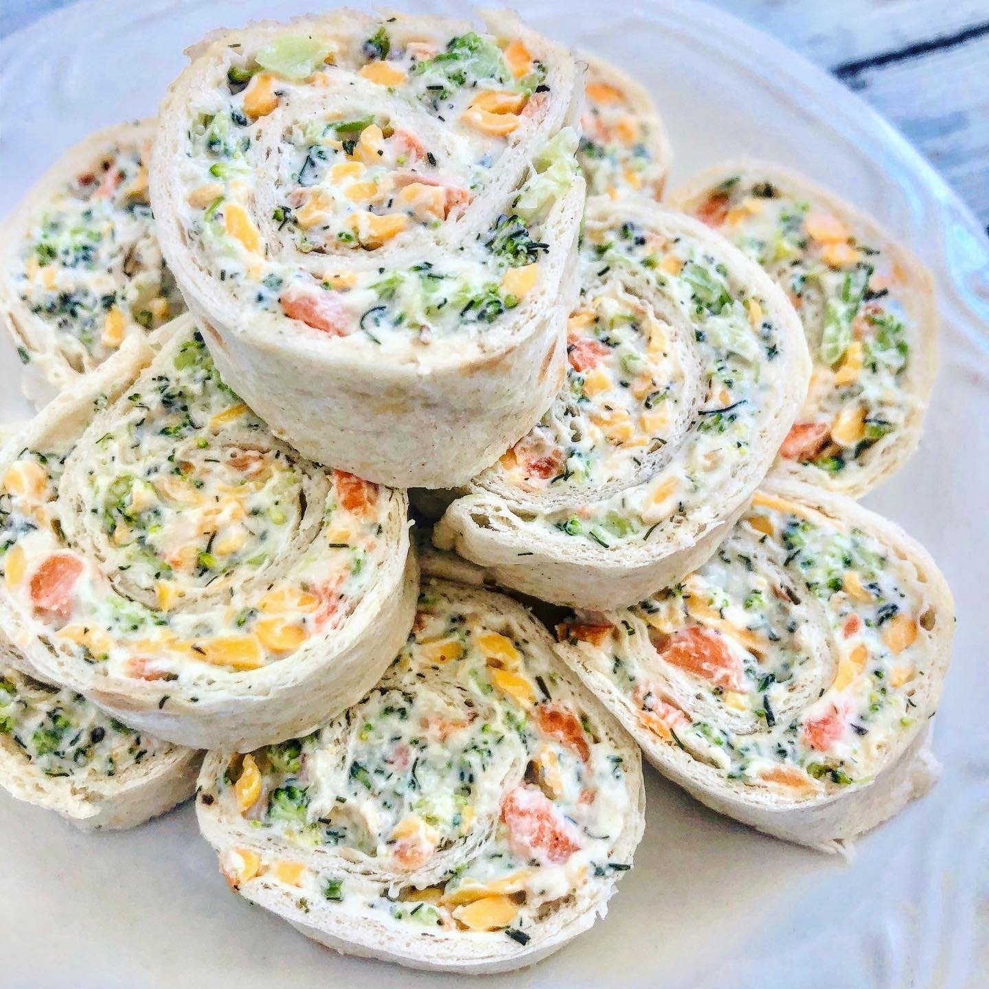 Vegan Veggie Pinwheels - Broccoli and carrots with all-vegan cream cheese, mayonnaise, cheddar cheese, herbs & spices for an easy, crowd-pleasing appetizer! via @thiswifecooks