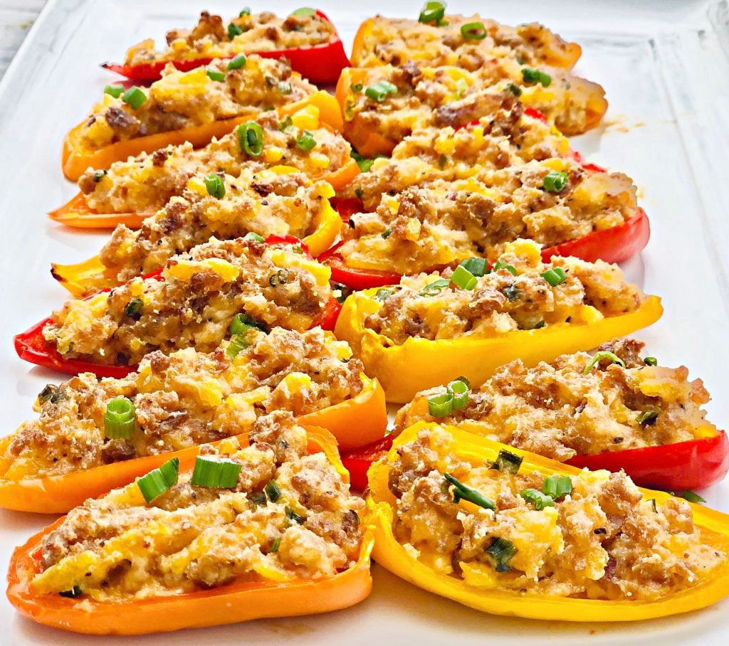 Vegan Sausage and Cheddar Stuffed Mini Peppers - Sweet mini peppers are stuffed with a savory filling of simple ingredients then baked for an easy make-ahead appetizer! These colorful, flavorful crowd-pleasing bites are ready to serve in under 30 minutes! | thiswifecooks.com #veganappetizers #meatlessmonday #thiswifecooks