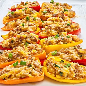 Vegan Sausage and Cheddar Stuffed Mini Peppers - Sweet mini peppers are stuffed with a savory filling of simple ingredients then baked for an easy make-ahead appetizer! These colorful, flavorful crowd-pleasing bites are ready to serve in under 30 minutes! | thiswifecooks.com #veganappetizers #meatlessmonday #thiswifecooks