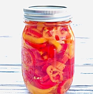 Sweet and Spicy Pickled Mini Peppers A quick and easy recipe for pickling peppers! #howtopicklepeppers #canningrecipes #pickledpeppers #whattodowithminipeppers #canningandpreserving #thiswifecooksrecipes