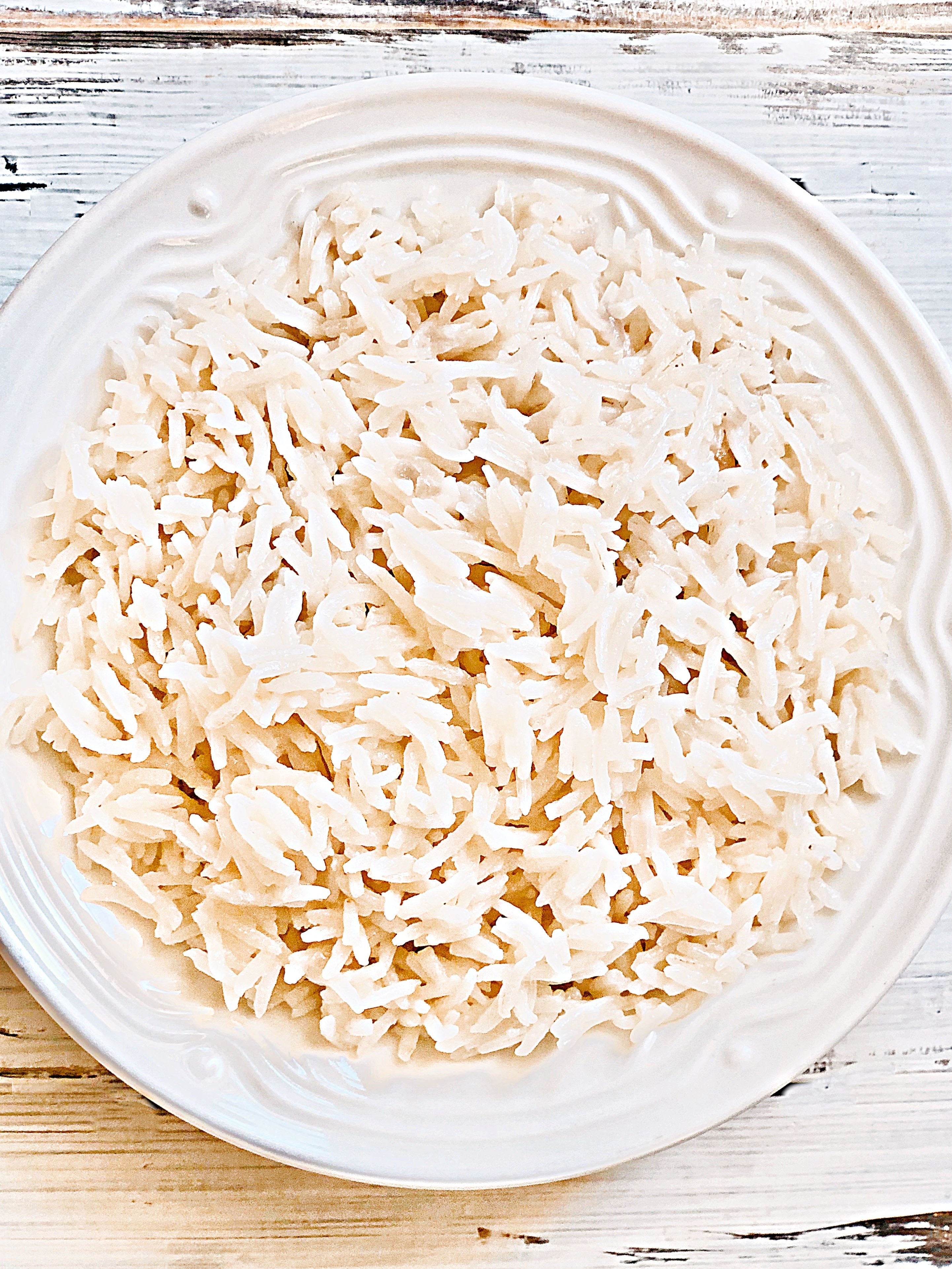 Basmati Coconut Rice - an easy and delicious way to elevate a meal with only a few simple ingredients.

#coconutrice #basmatirice #easyricerecipes #pantryrecipes #quarantinecooking #thiswifecooksrecipes #plantbasedrice #veganrice #indianrice #caribbeanrice via @thiswifecooks