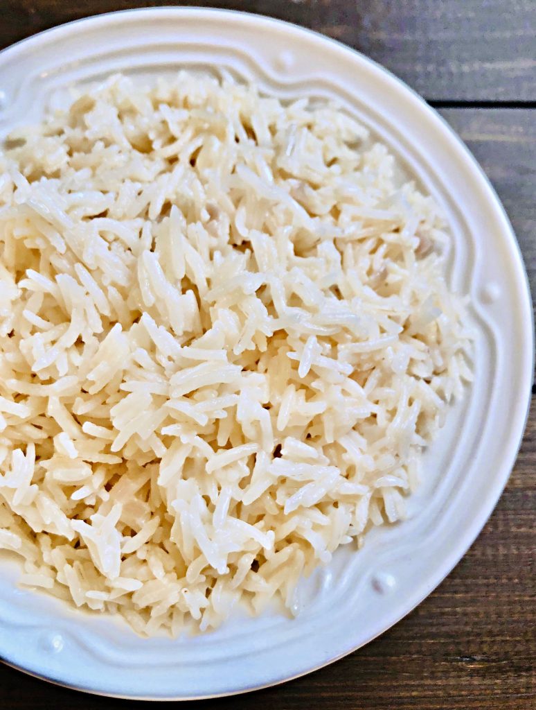 Basmati Coconut Rice - an easy and delicious way to elevate a meal with only a few simple ingredients. #coconutrice #basmatirice #easyricerecipes #pantryrecipes #quarantinecooking #thiswifecooksrecipes #plantbasedrice #veganrice #indianrice #caribbeanrice