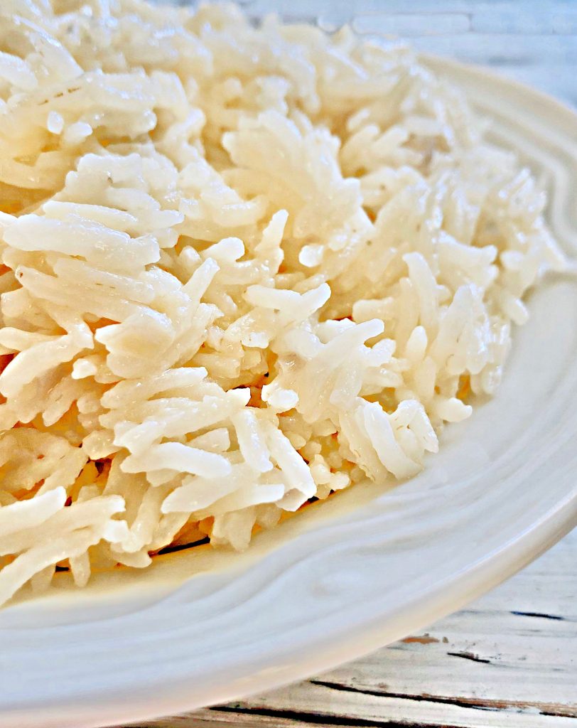 Basmati Coconut Rice - an easy and delicious way to elevate a meal with only a few simple ingredients. #coconutrice #basmatirice #easyricerecipes #pantryrecipes #quarantinecooking #thiswifecooksrecipes #plantbasedrice #veganrice #indianrice #caribbeanrice