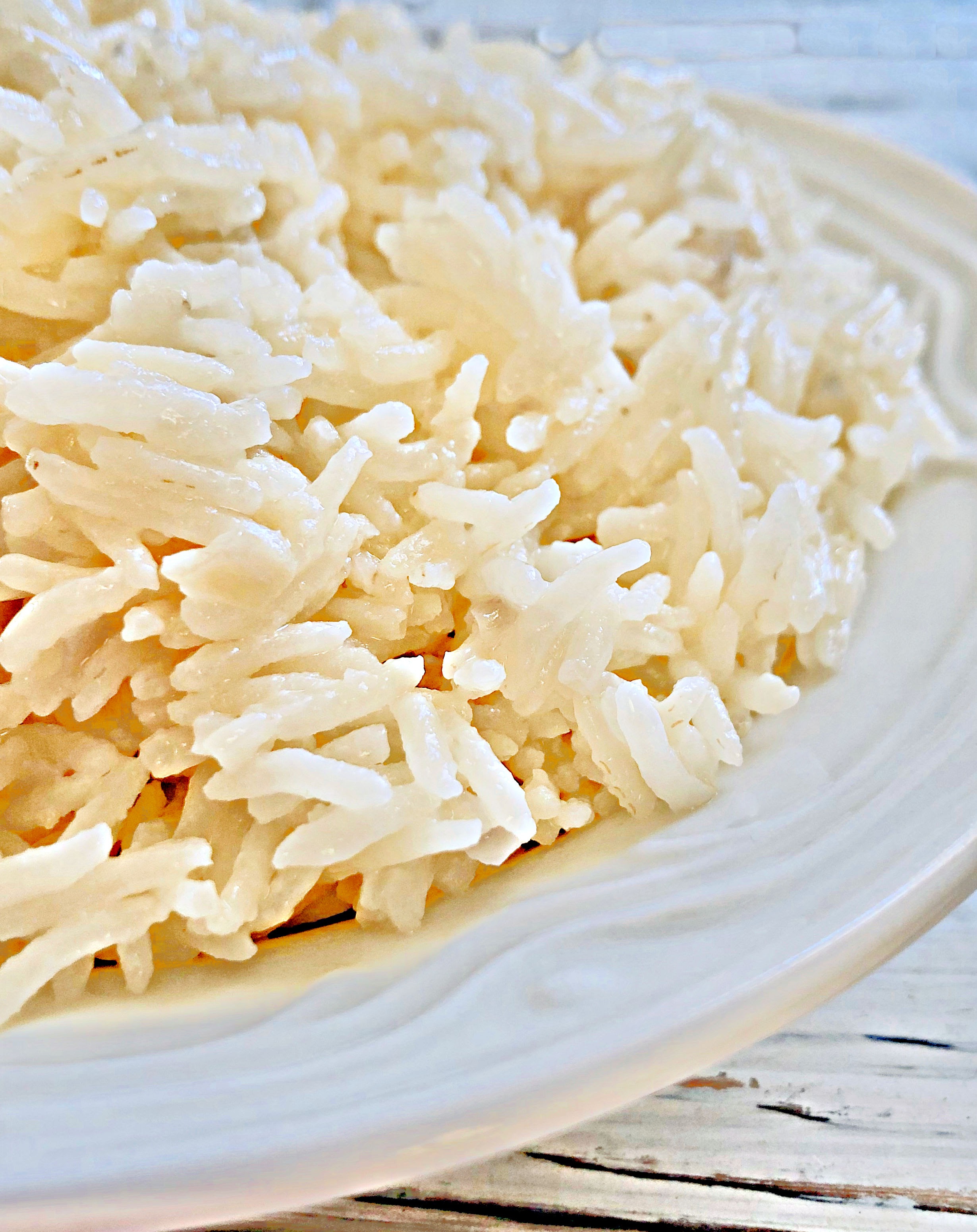 Basmati Coconut Rice - an easy and delicious way to elevate a meal with only a few simple ingredients.

#coconutrice #basmatirice #easyricerecipes #pantryrecipes #quarantinecooking #thiswifecooksrecipes #plantbasedrice #veganrice #indianrice #caribbeanrice via @thiswifecooks