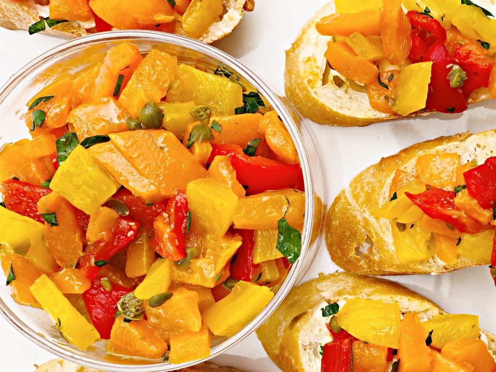 Sweet Bell Pepper Bruschetta - Colorful bell peppers are marinated with olive oil, white balsamic vinegar, capers, and Italian flat-leaf parsley for a quick and easy appetizer perfect for entertaining.