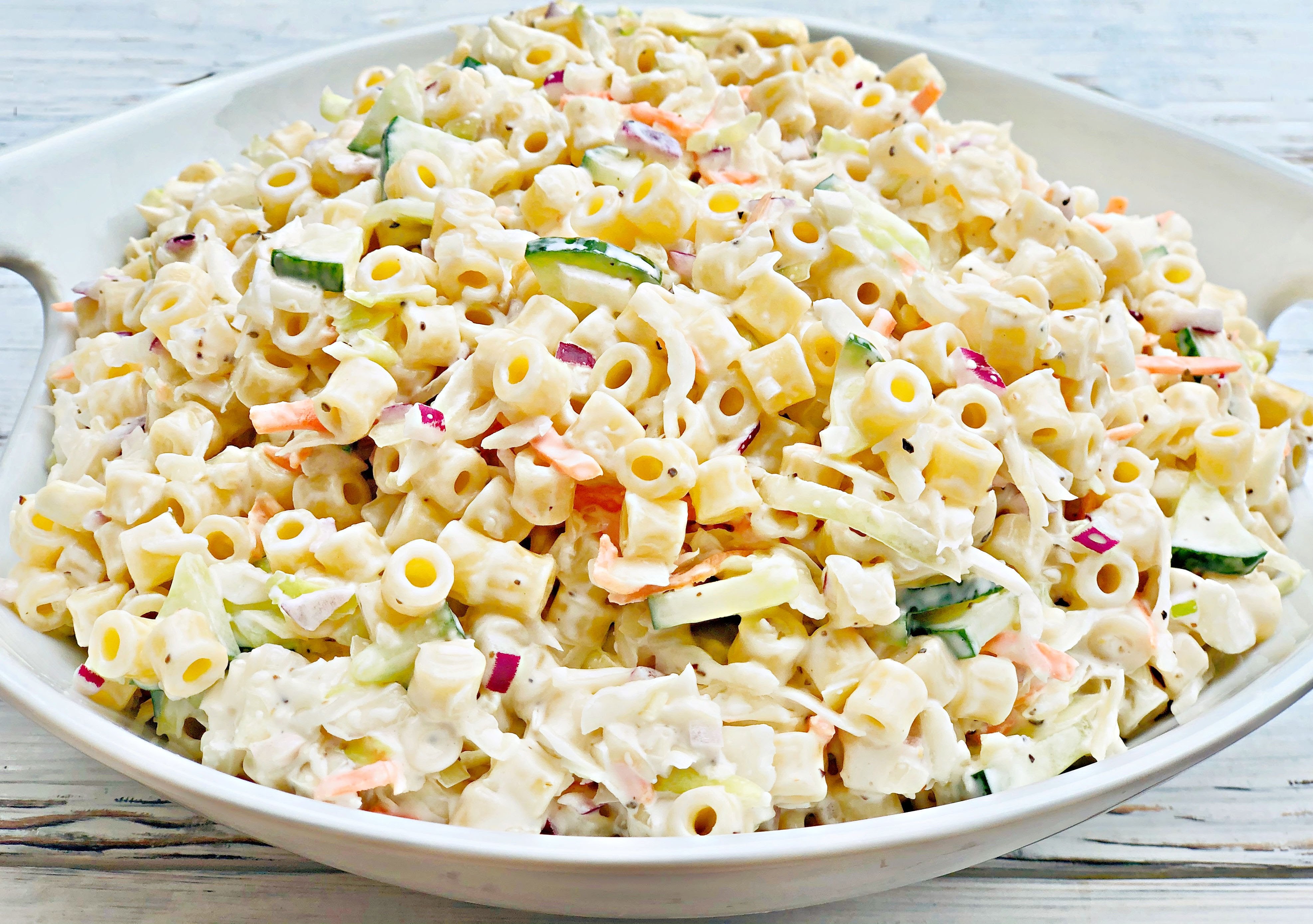 Coleslaw Pasta Salad - An easy, make-ahead side dish recipe perfect for backyard barbecues, potlucks, and holiday gatherings! via @thiswifecooks
