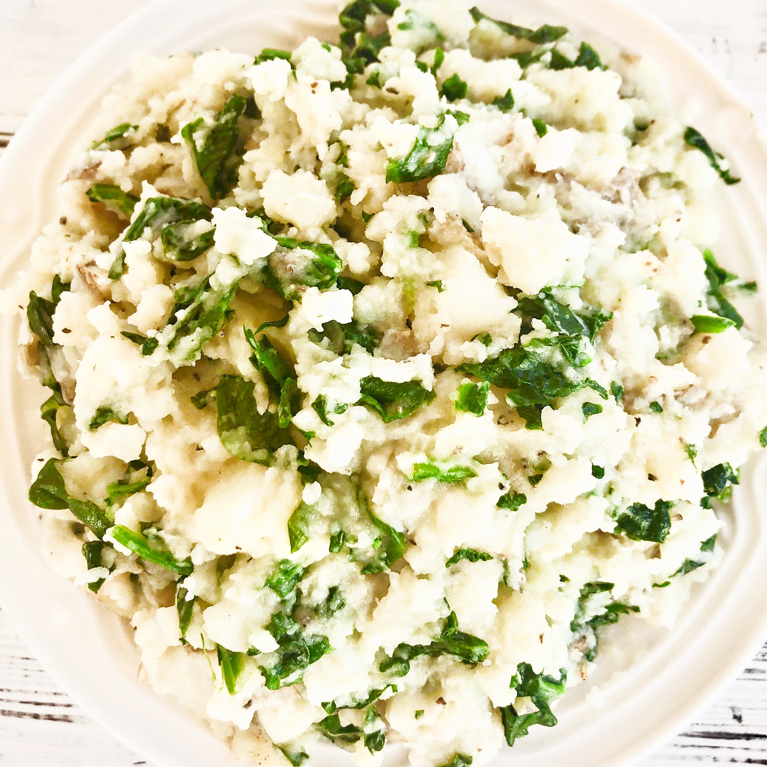 Spinach Mashed Potatoes - Fresh spinach sauteed with garlic with creamy mashed potatoes, butter, and seasonings. This hearty and healthy side dish is ready to serve in about 20 minutes.  via @thiswifecooks