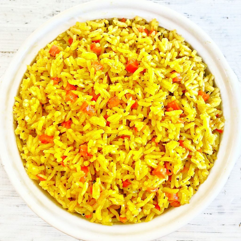 Yellow Rice ~ Arroz Amarillo - Spanish for "yellow rice" - is savory turmeric spiced rice that is easy to make with simple ingredients. Ready to serve in under 30 minutes.
