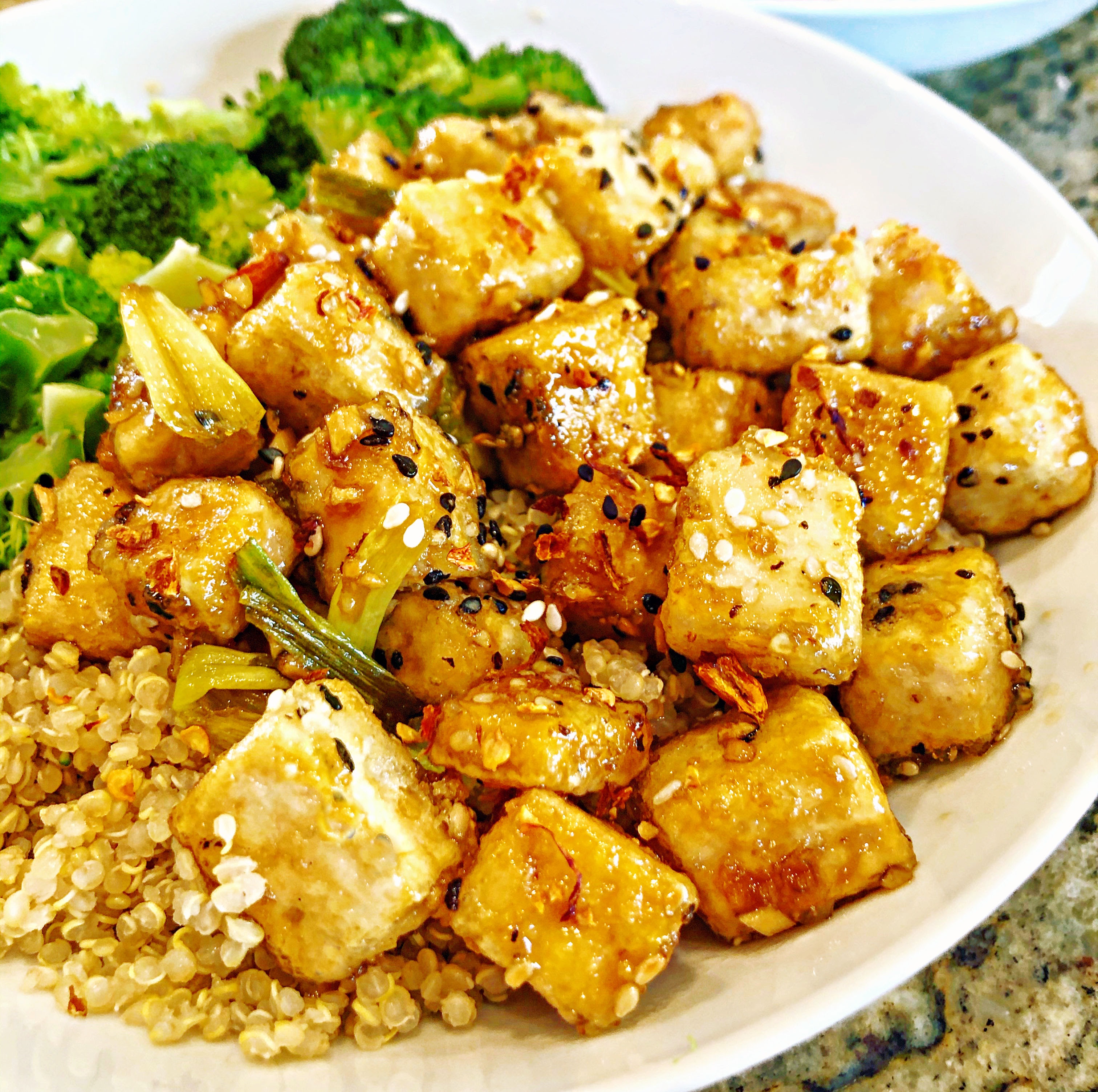 Crispy pan-fried tofu tossed in a sweet garlic and ginger sauce. Super easy to make and ready to serve in less time than it takes to get takeout!