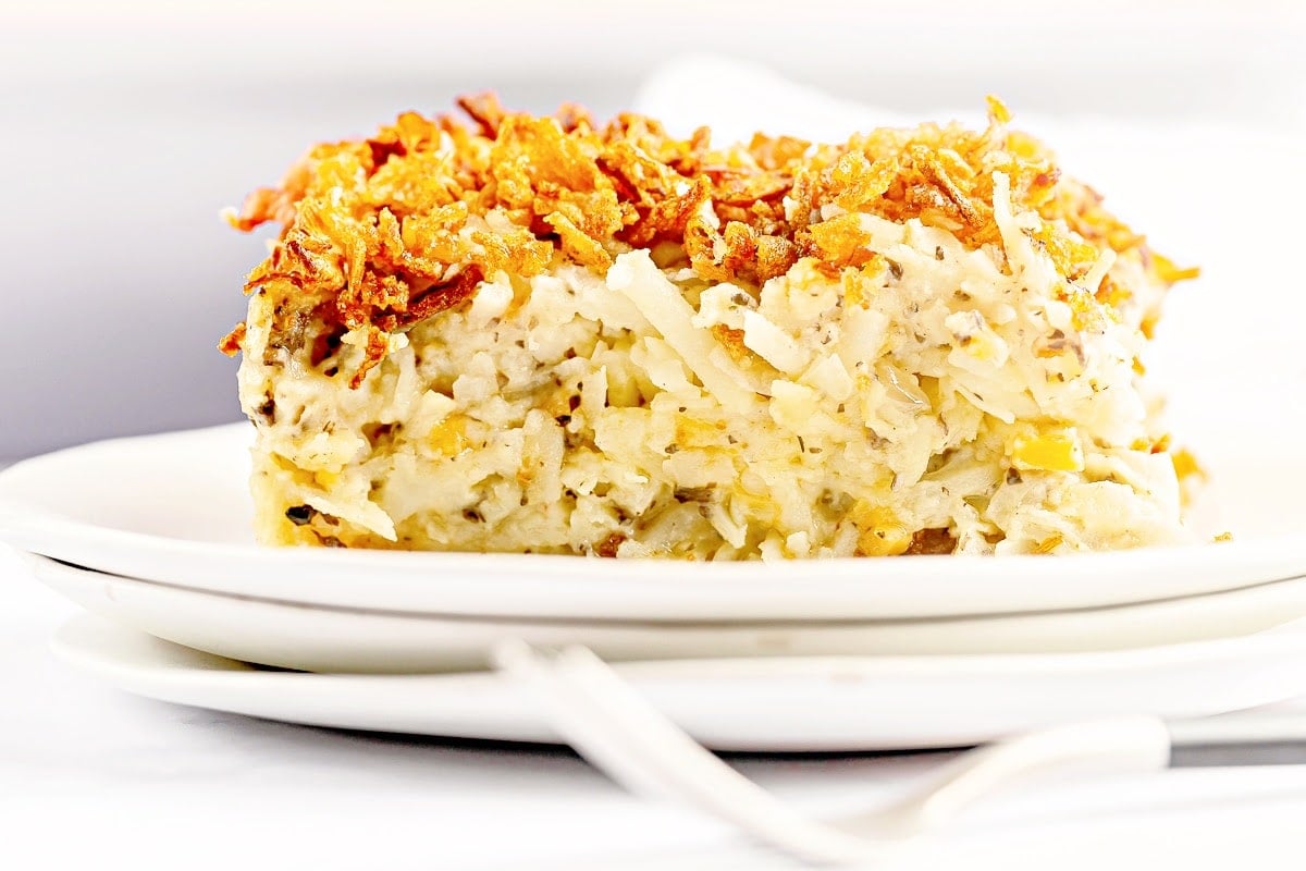 Hash Brown Casserole ~ This easy to make, classic breakfast casserole is dairy-free, contains no canned soup, and is perfect for brunch, holiday breakfasts, baby showers, and more!  Shredded hash brown potatoes are baked in a creamy mixture that includes dairy-free cheeses, sour cream, and fresh mushrooms. All topped off with a layer of fresh and crispy fried onions.