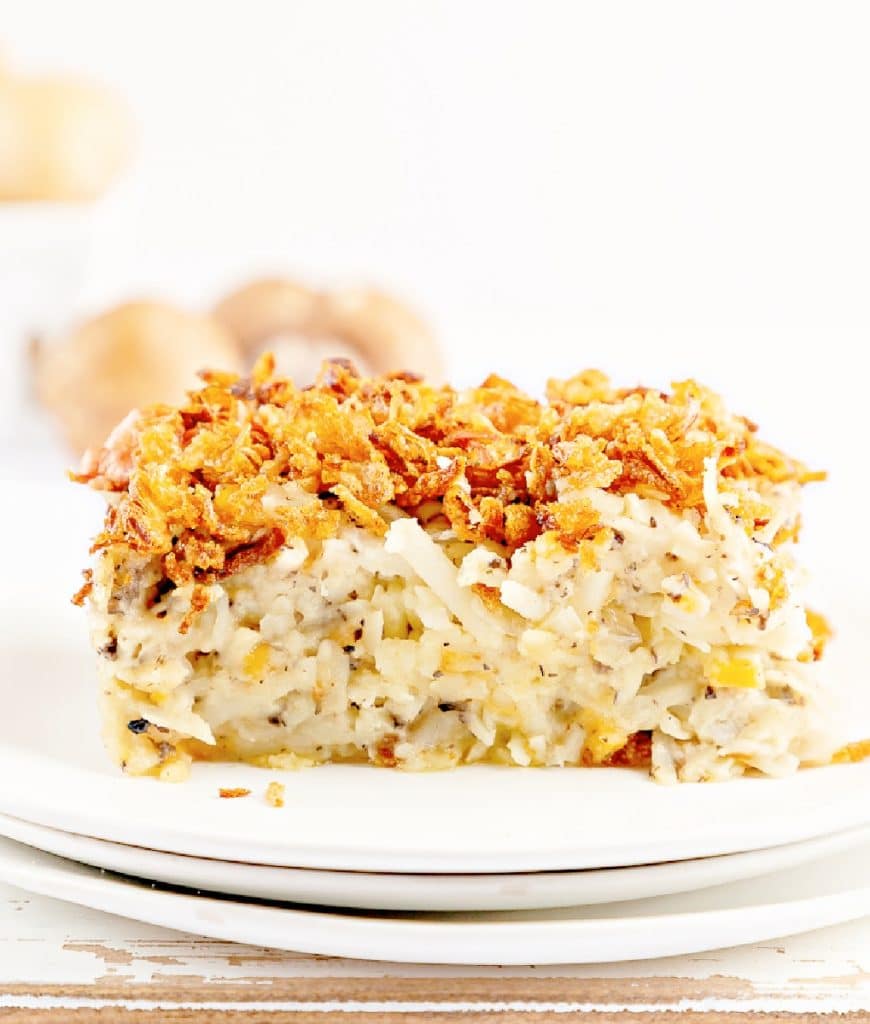 Hash Brown Casserole ~ This easy to make, classic breakfast casserole is dairy-free, contains no canned soup, and is perfect for brunch, holiday breakfasts, baby showers, and more!  Shredded hash brown potatoes are baked in a creamy mixture that includes dairy-free cheeses, sour cream, and fresh mushrooms. All topped off with a layer of fresh and crispy fried onions.