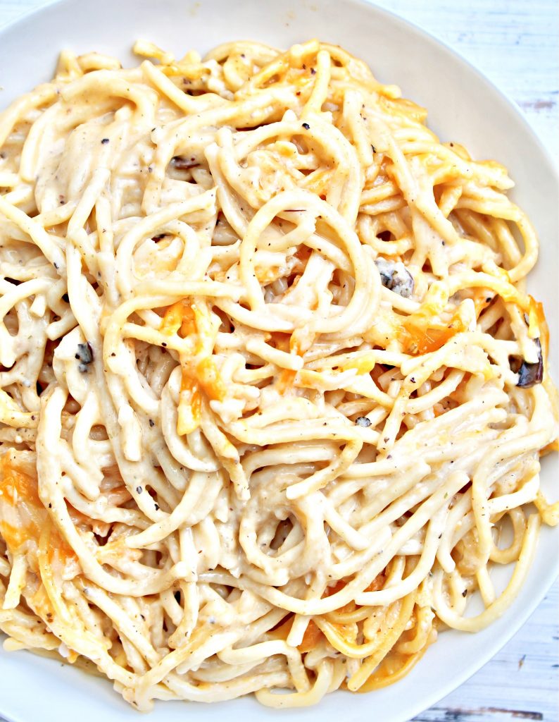 Easy Cheesy Tetrazzini ~ Spaghetti pasta tossed in a rich and creamy, dairy-free cheese sauce then baked for an ultra comforting casserole the whole family will love. This kid-friendly pasta bake is ready to serve in about an hour.