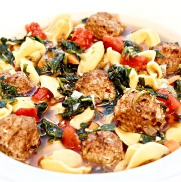 Meatball Tortellini Soup ~ Veggie meatballs and dairy-free cheese-filled tortellini served in a savory and meatless beef-style broth with carrots, onion, garlic, spinach, tomatoes, and seasonings. This is a simple yet robust and flavorful soup that is quick and easy to make in 30 minutes or less!