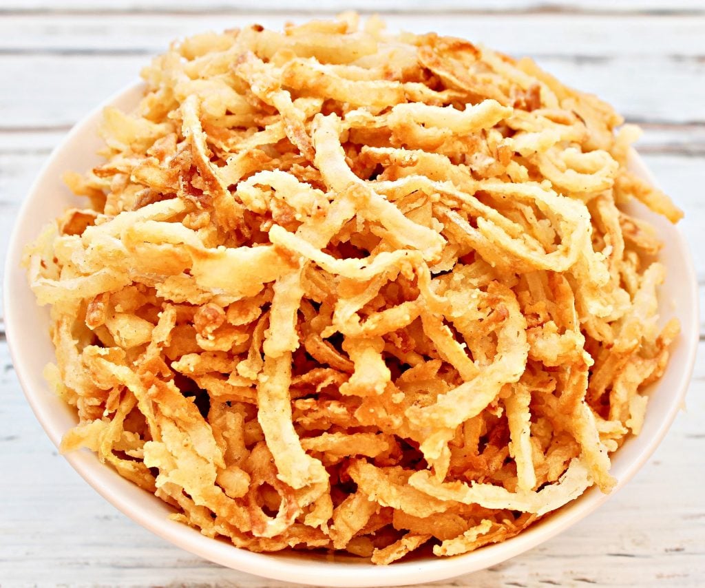 French Fried Onions ~ Super crispy, loaded with flavor, and easy to make. Fried onions are great for topping burgers, soups, salads, and casseroles. Once you see how quick and simple it is to make your own - and taste the difference! - you'll never go back to the canned stuff again.