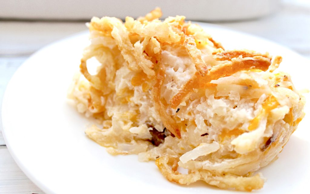The classic breakfast casserole! Shredded hashbrown potatoes baked in a creamy sauce then topped with fresh and crispy fried onions.