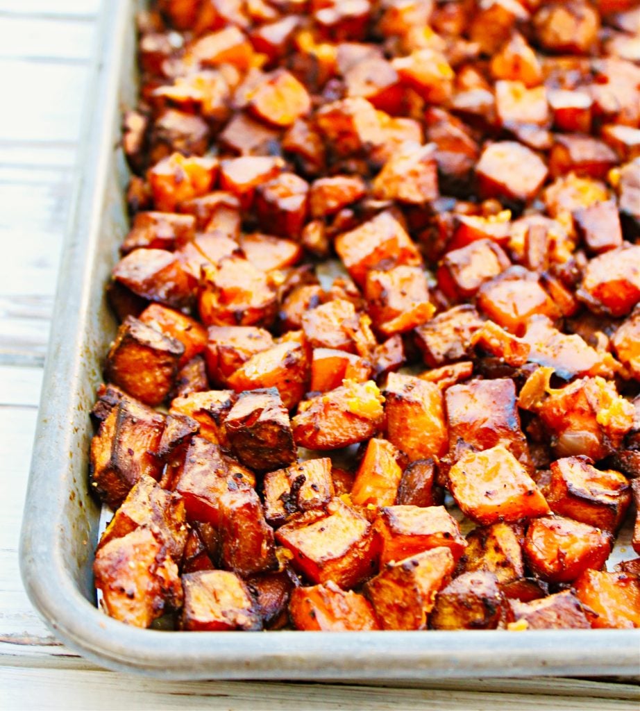 Cubed sweet potatoes tossed with red onion, smoked paprika, and simple seasonings then roasted in the oven for about 45 minutes. This sheet pan recipe is super easy and perfect for brunch or breakfast-for-dinner night!