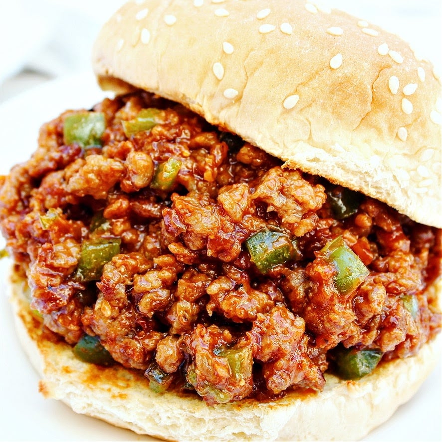 Close-up of a vegan sloppy joe sandwich on burger bun.
