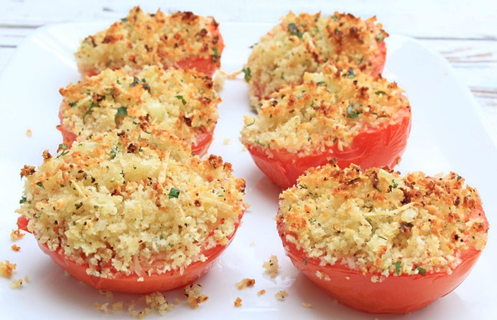 Baked Tomatoes on a white serving plate.