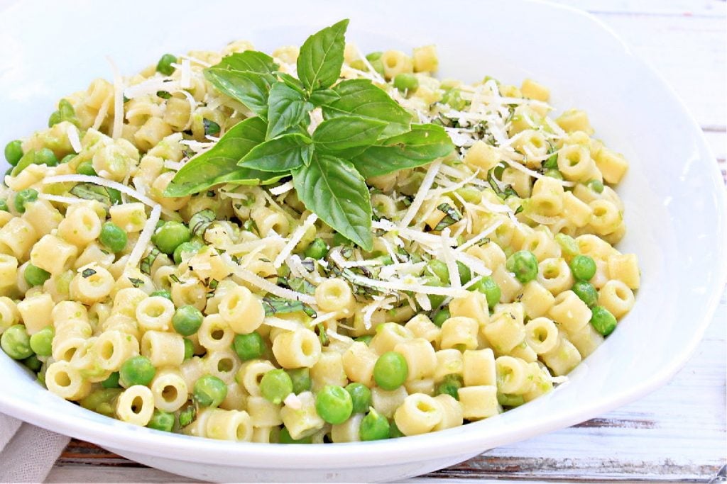 SIde angle view of pasta with peas.