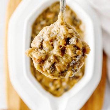 Ladle filled with a serving of gravy.