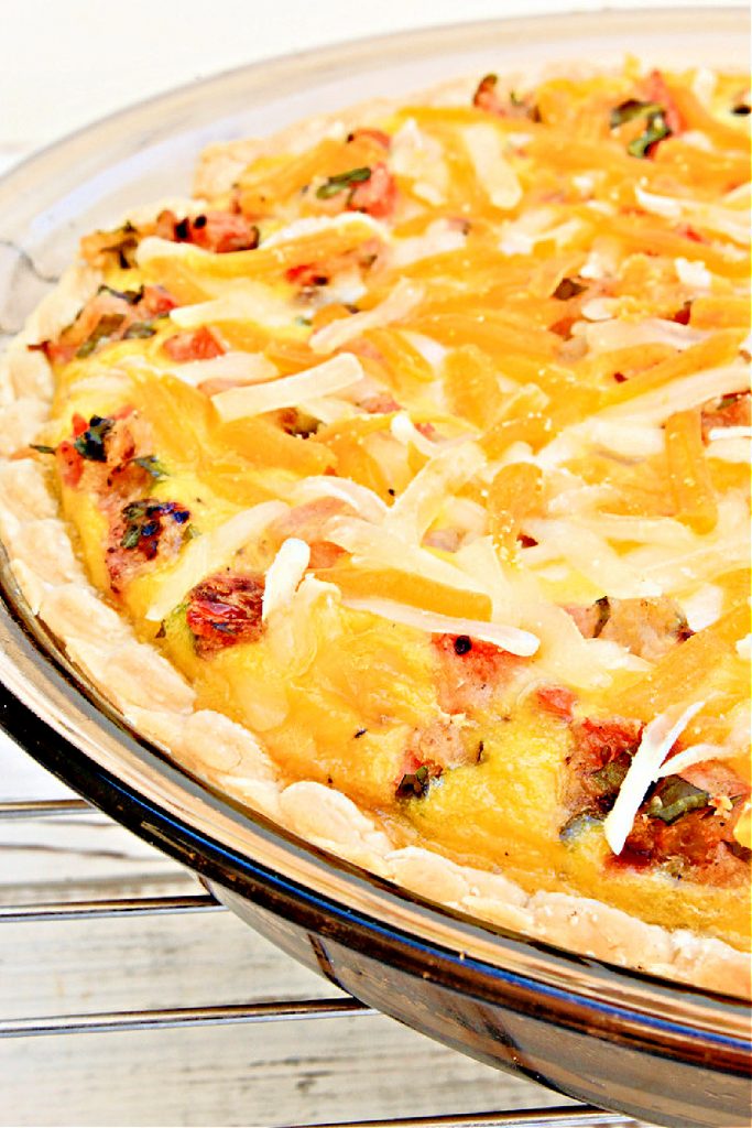 Tomato and Basil Quiche ~ An easy and dairy-free quiche made with JUST Egg. Perfect for brunch or dinner! Serve with roasted potatoes or a side salad and you're all set!