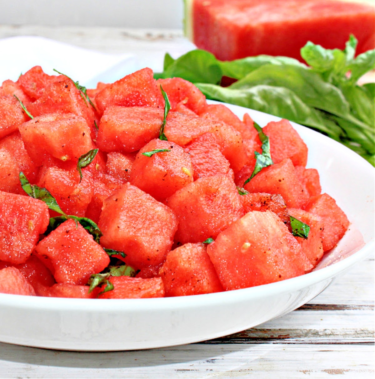 Watermelon Basil Salad is light, refreshing, and simple to make! Chili powder, lemon, & salt counterbalance the sweetness of the watermelon.