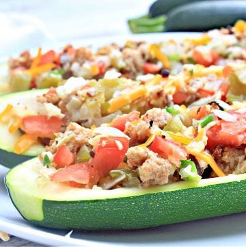 Baked Zucchini Boats ~ These garden-fresh zucchini stuffed with veggies serve 4 as a light main course or 8 as a side dish.