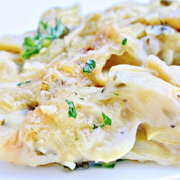 Artichoke Gratin ~ Artichokes smothered in a savory, creamy, dairy-free sauce then baked until bubbly. Simple and elegant for the holidays!