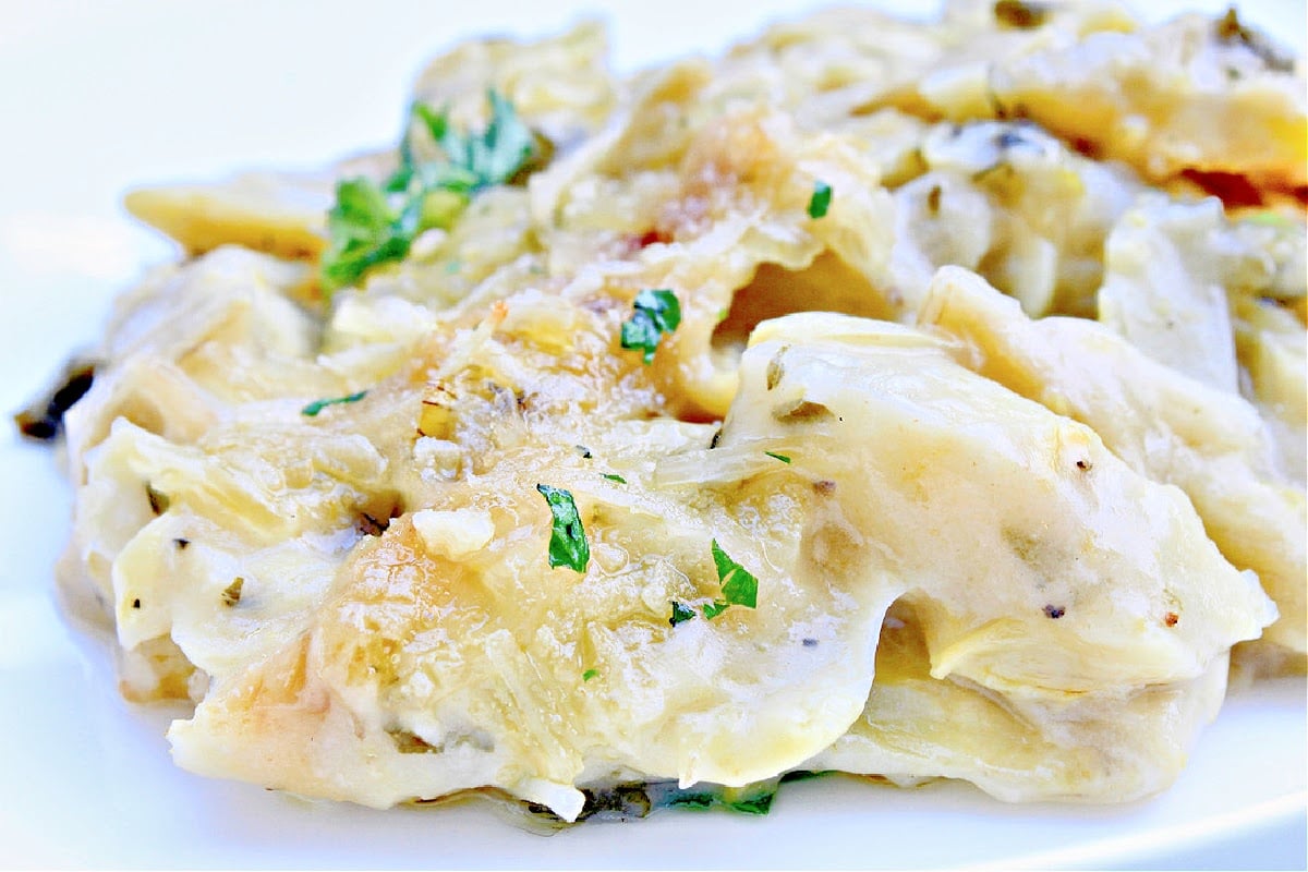 Artichoke Gratin ~ Artichokes smothered in a savory, creamy, dairy-free sauce then baked until bubbly. Simple and elegant for the holidays!